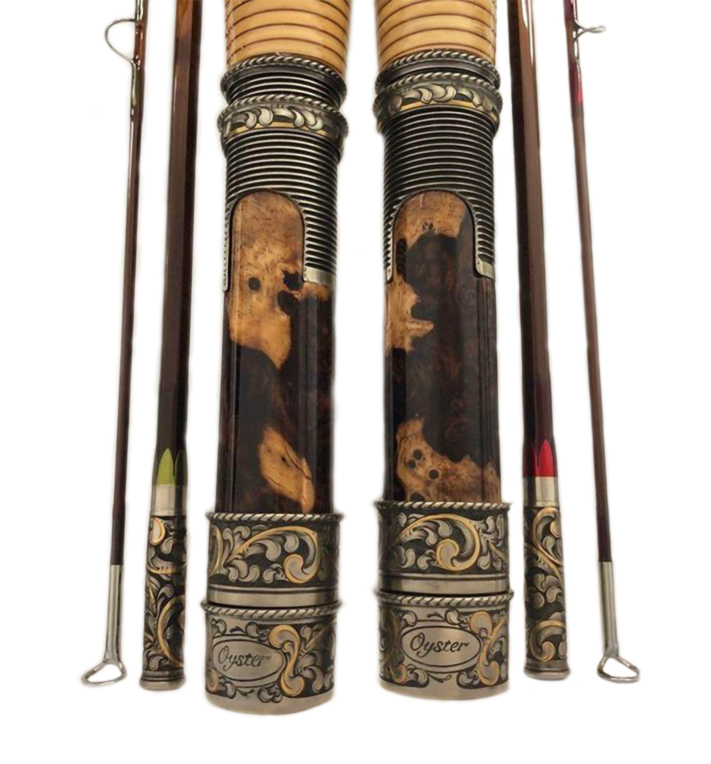 A pair of Oyster Bamboo fly rods with ornate hand-engraved seats.