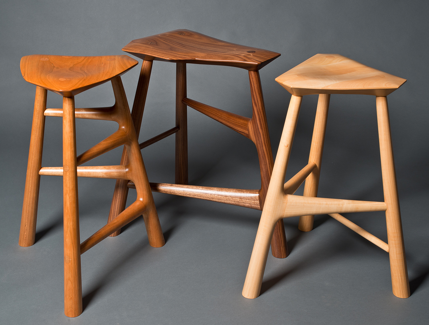 Handmade wooden stools in three different kinds of wood