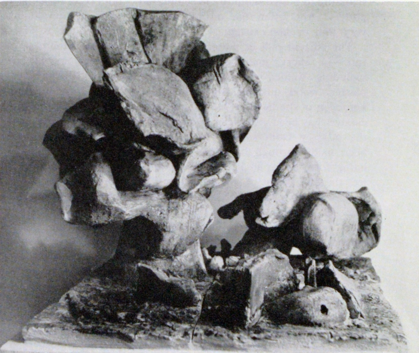 Fired stoneware sculpture with blobby organic forms.