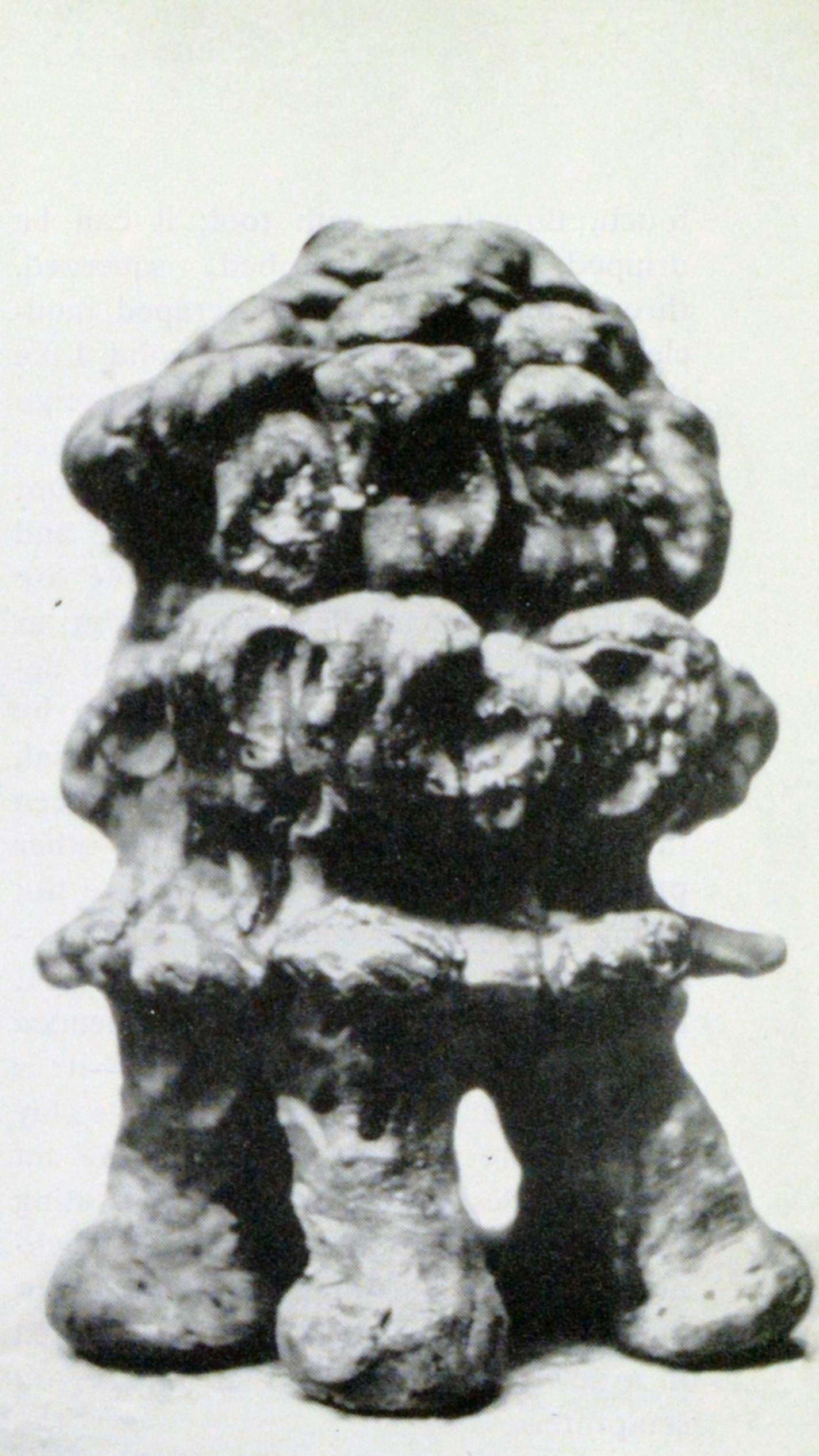 Lumpy stoneware piece with legs.