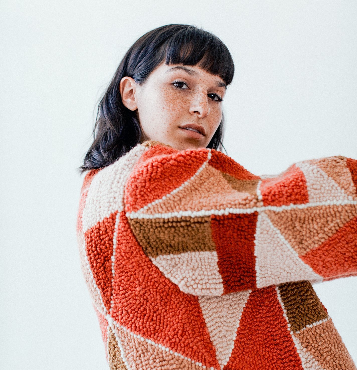 Punch needle coat inspired by the colors of New Mexico