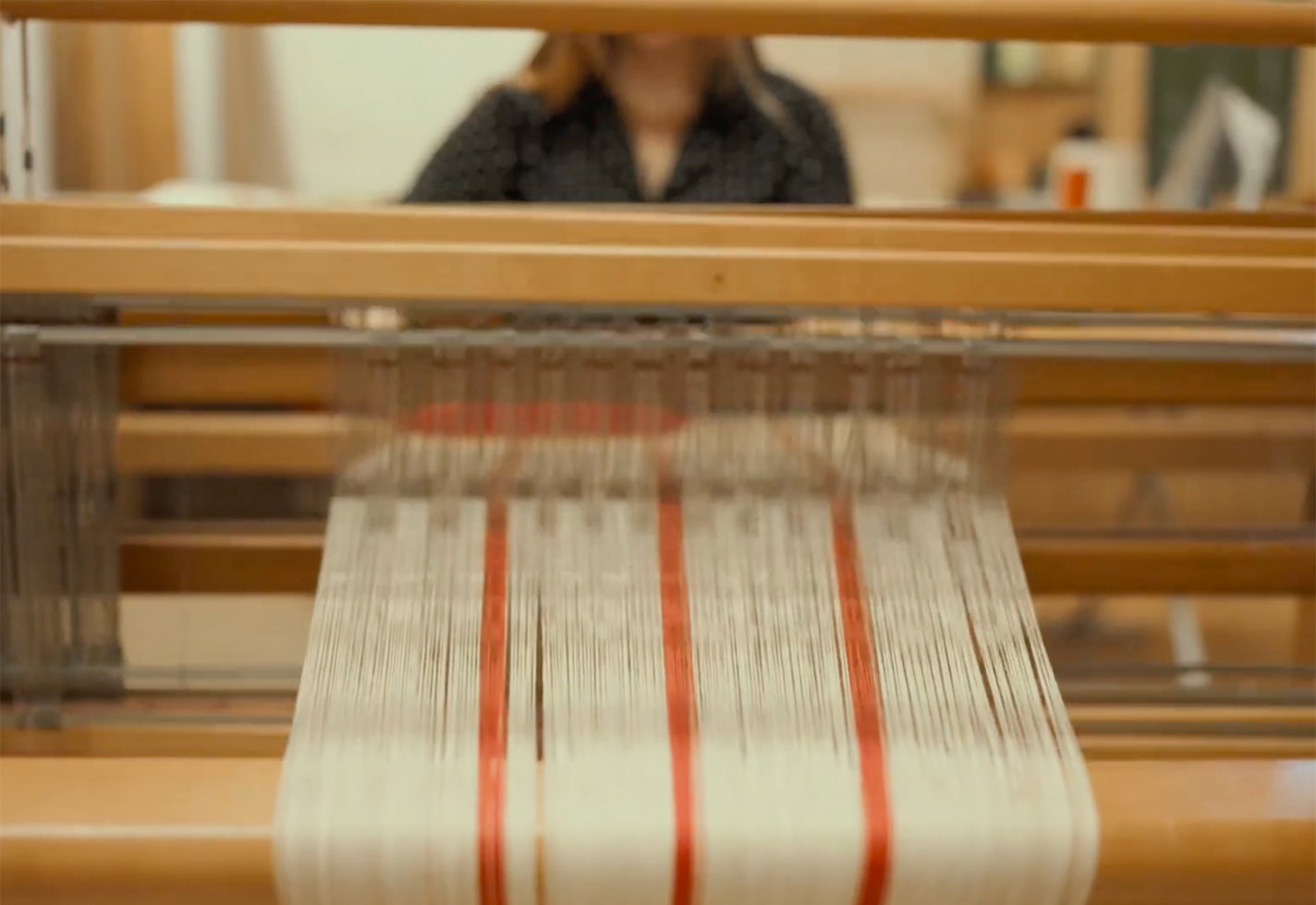 Molly Dudley works at her loom.