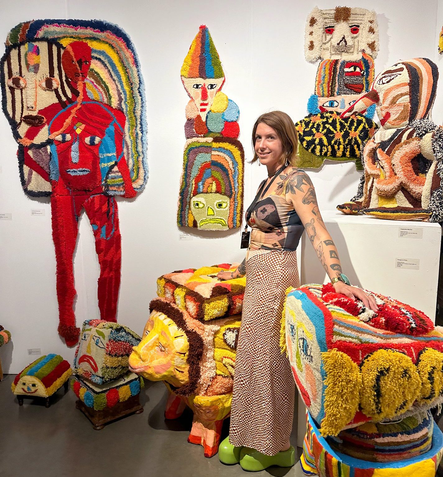 Monroe with her work at the Seattle Art Fair