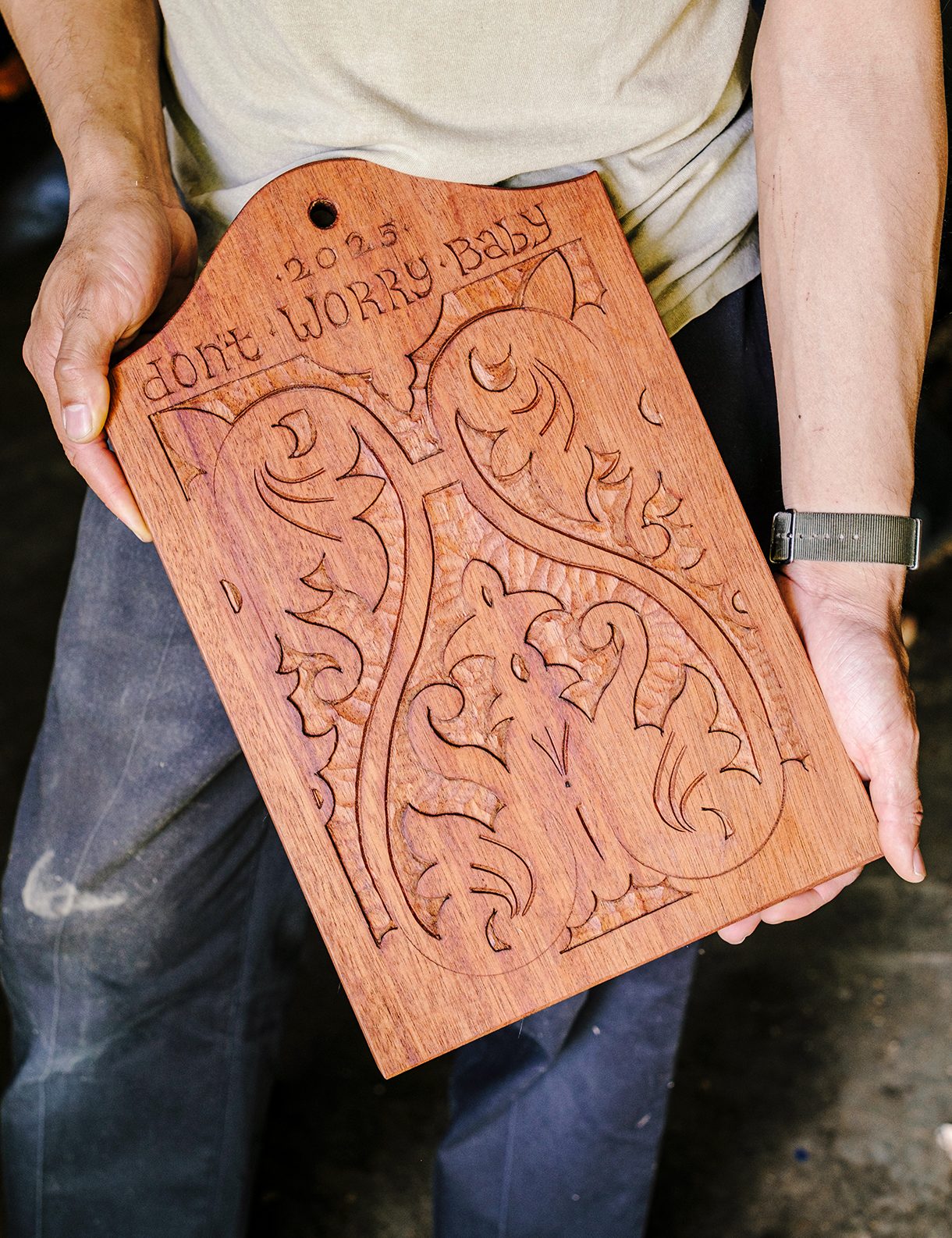 Mahogany wood panel with the words 