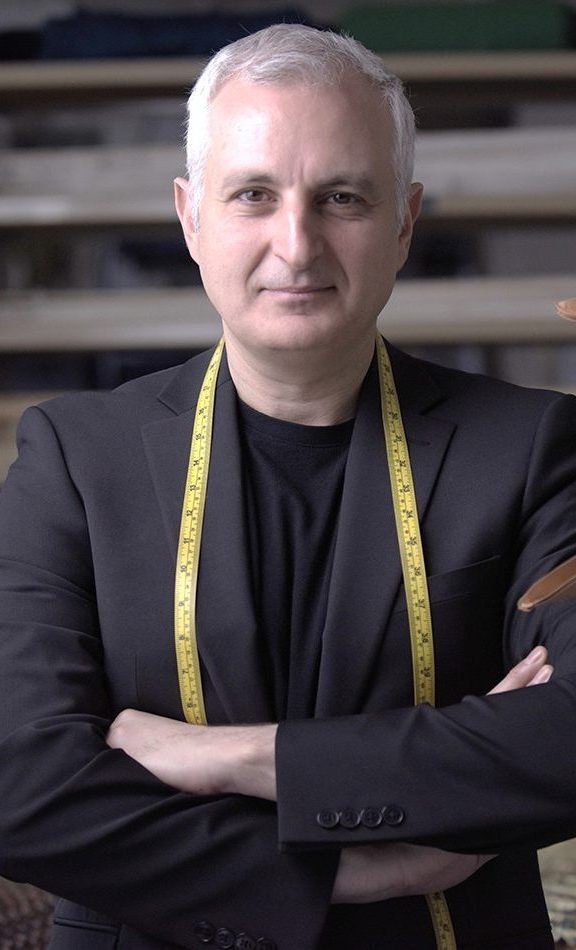 George Kalajian with tape measure