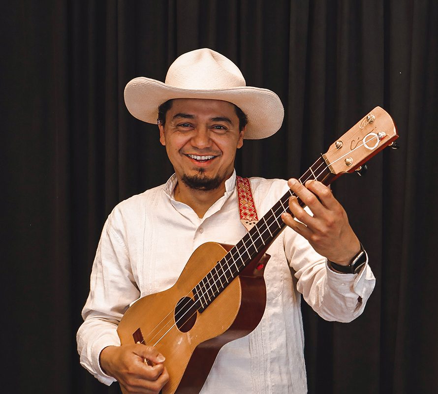 César Castro holding one of his instruments.