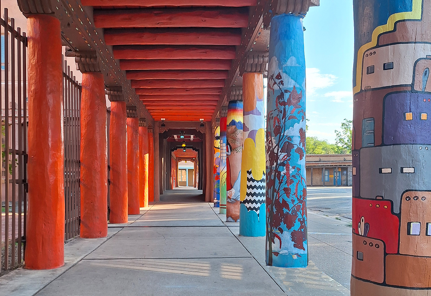 Vibrant poles line the entrance to the IAIA Museum of Contemporary Native Arts.