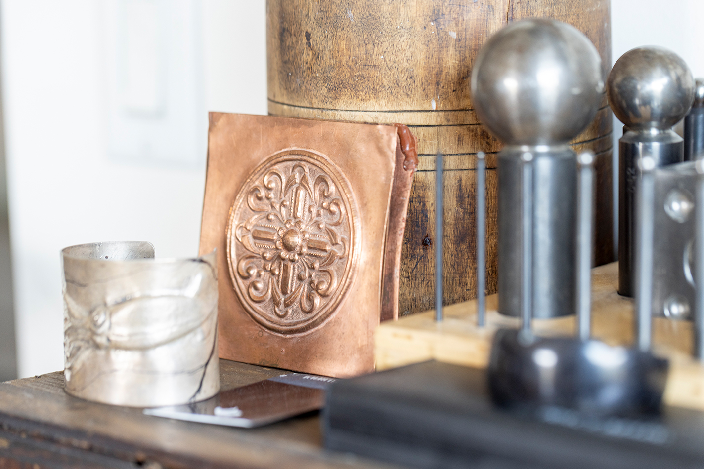 Two repoussé pieces in Ataumbi's studio.