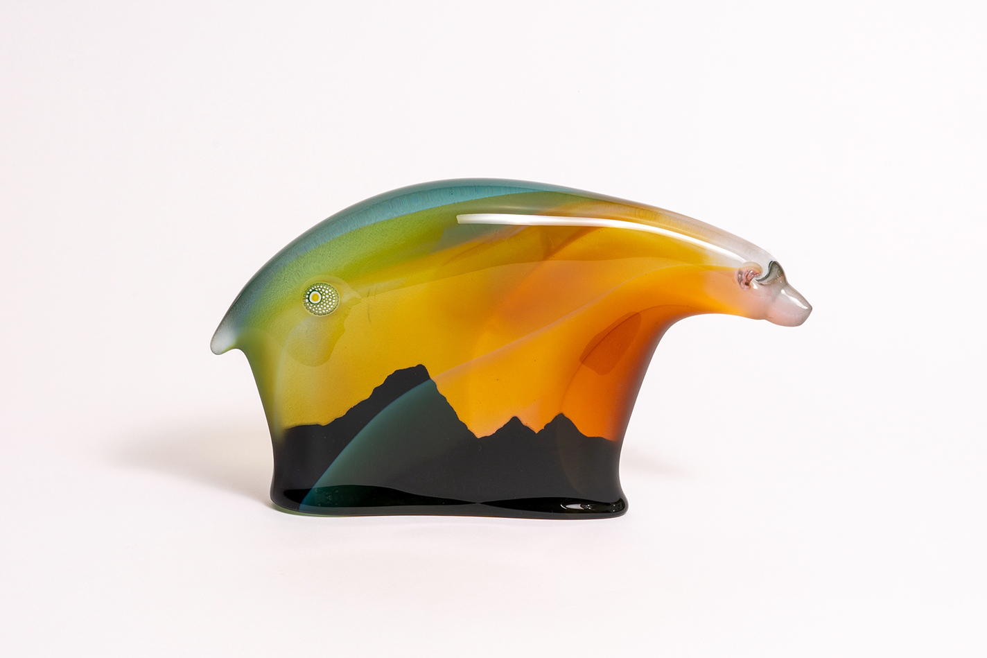 Glass bear sculpture showing the silhouette of Mount Baker