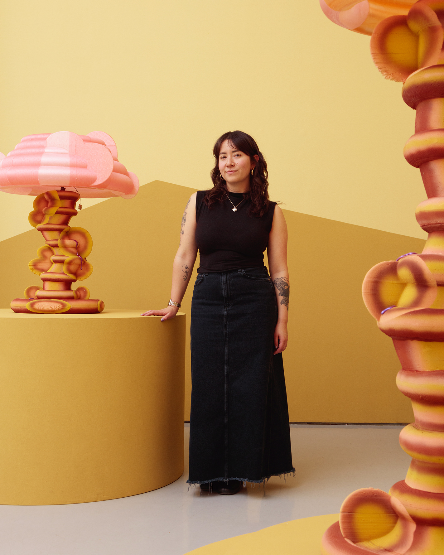 Portrait of the artist with two pieces of her work