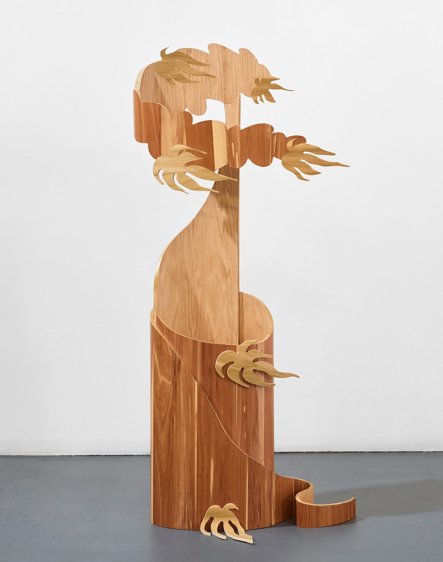 Towering plywood, veneer, and hardwood sculpture
