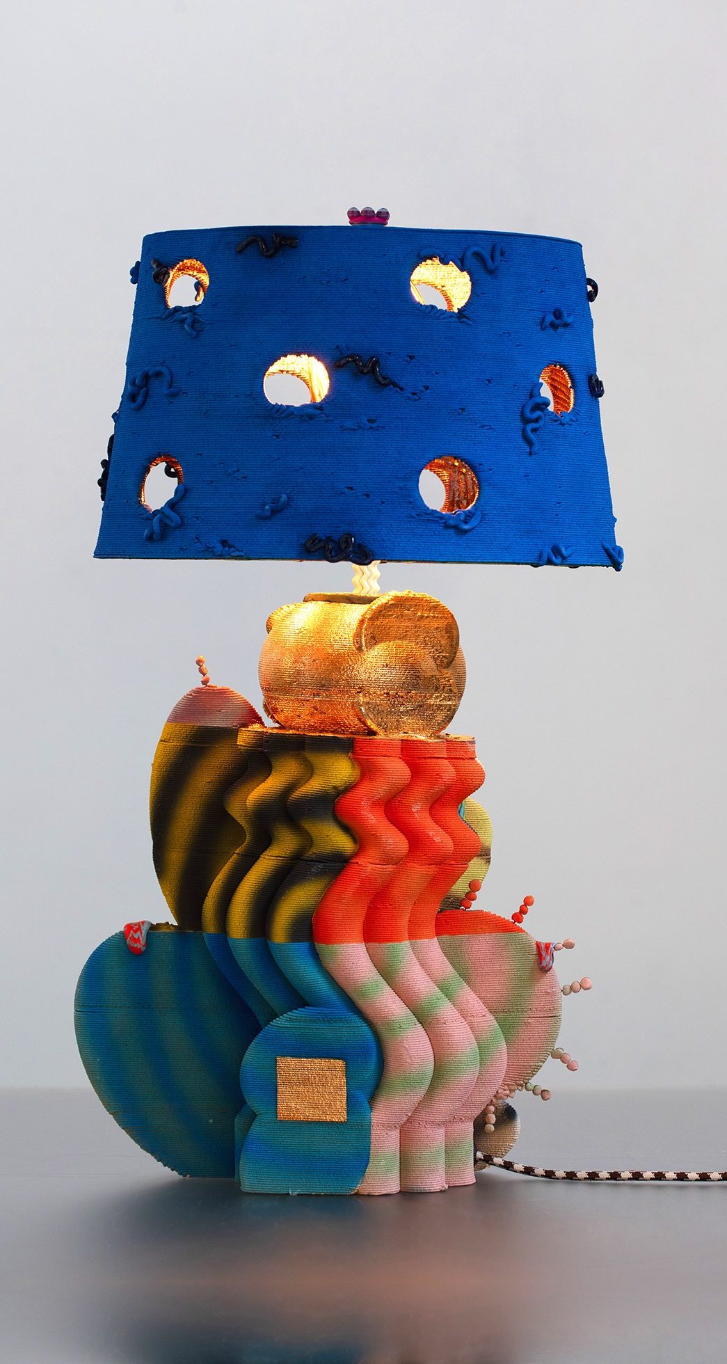 Table lamp with multicolored stoneware base