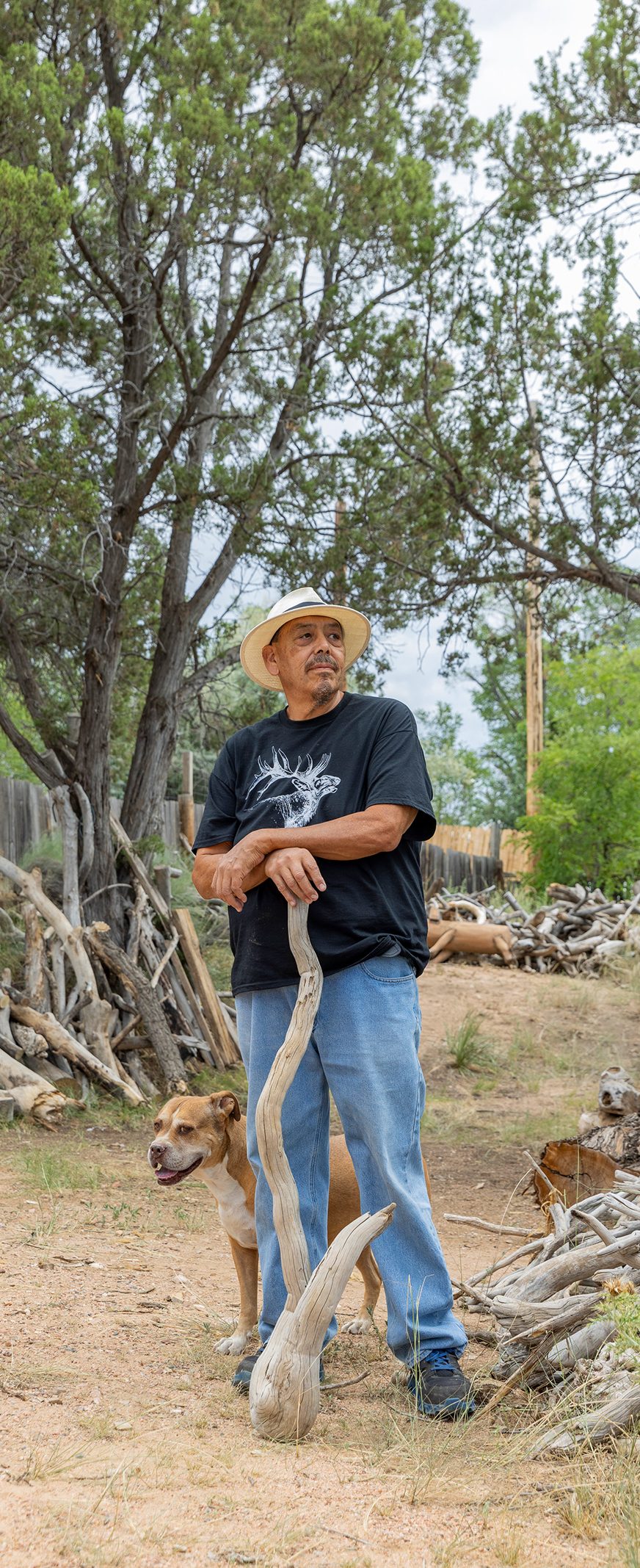 Peter Ortega with a piece of driftwood from a lake near his home.