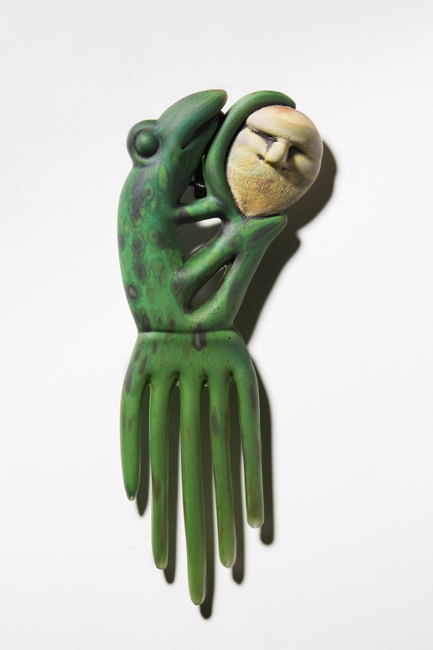 Hand-sculpted glass frog wall piece